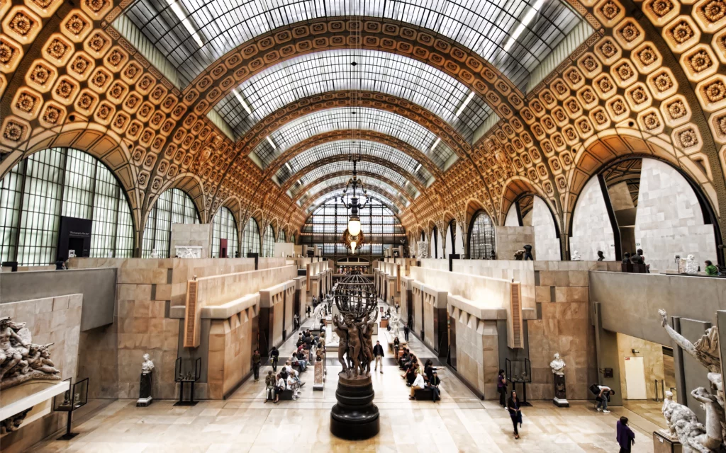 A glimpse of the stunning interior of the Musée d'Orsay, adorned with iconic Impressionist artworks.