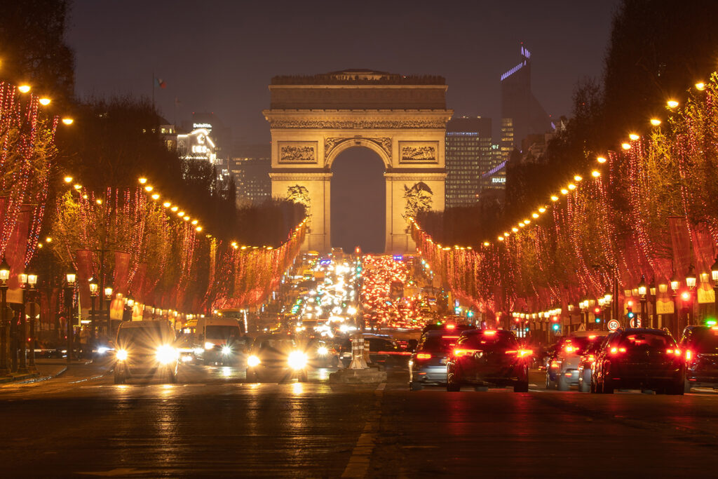 A taxi driver pointing out landmarks in Paris